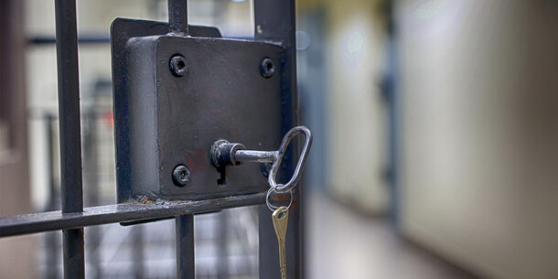 Jail cell with key in the lock