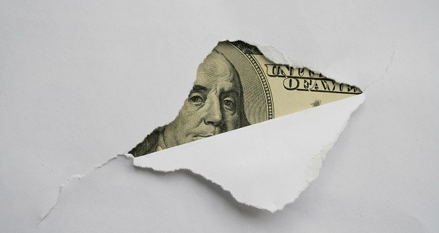 Money hidden behind paper