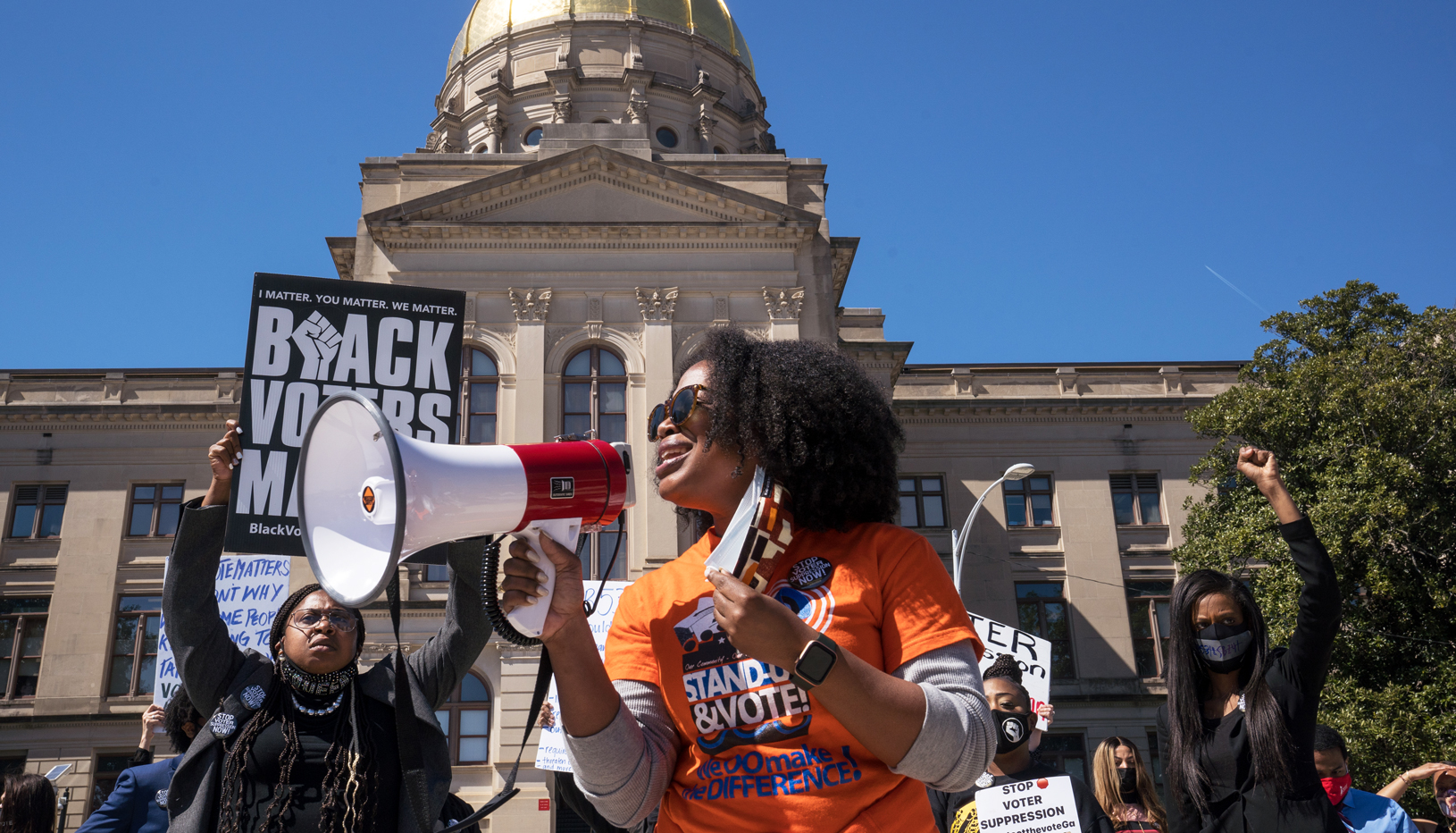 Voting rights activists protest Georgia voter suppression bills. 