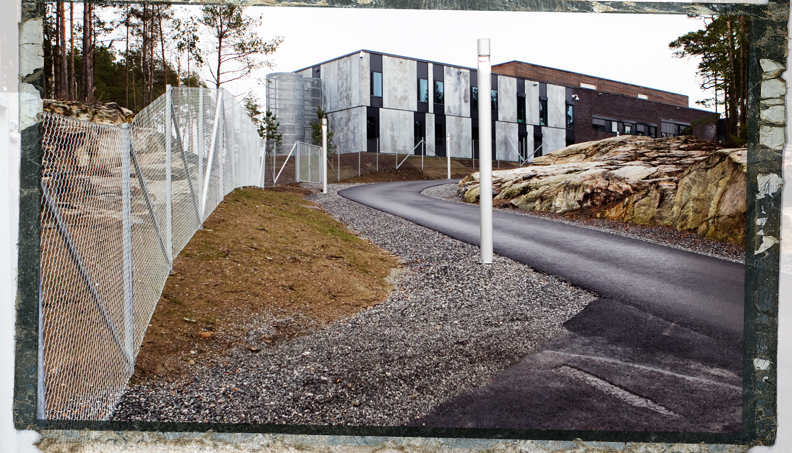 View of the drive up to a prison with modern architecture