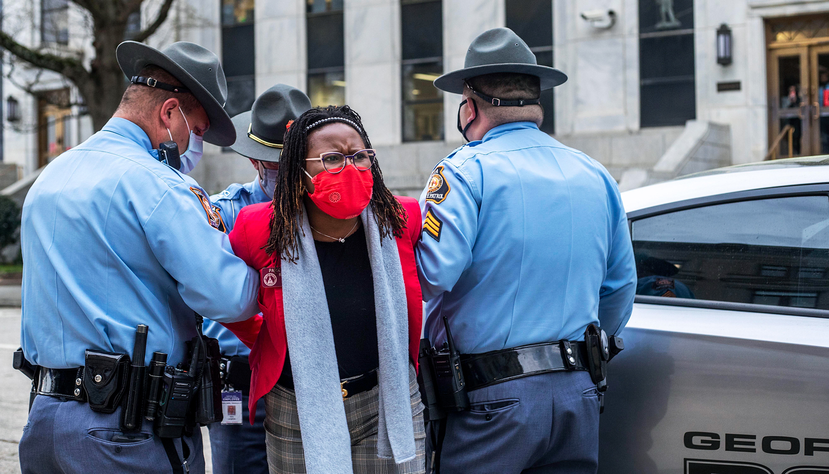 Park Cannon is escorted away by Georgia State Troopers