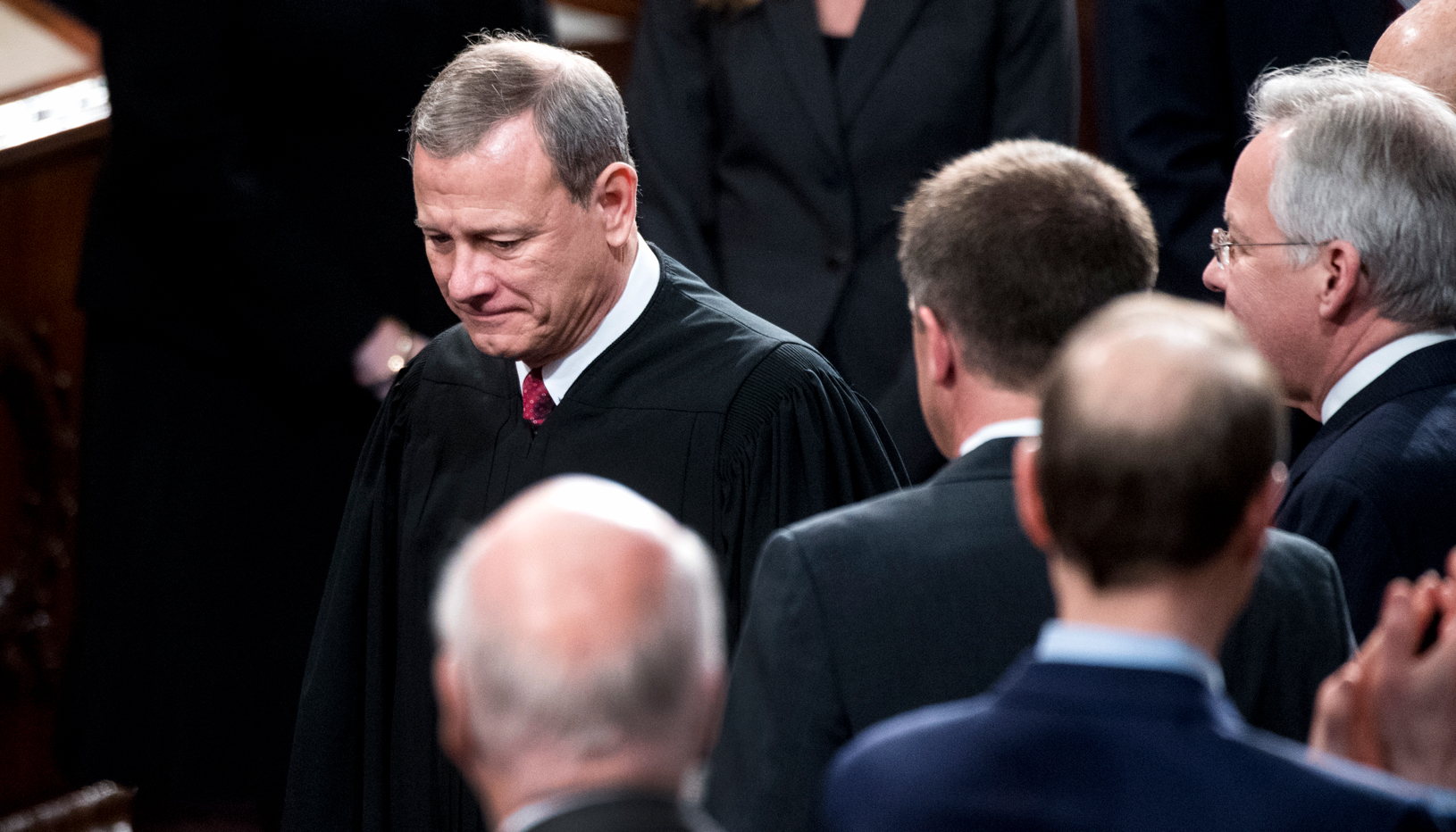 Chief Justice John Roberts stands among the crowd at President Joe Biden's inauguration