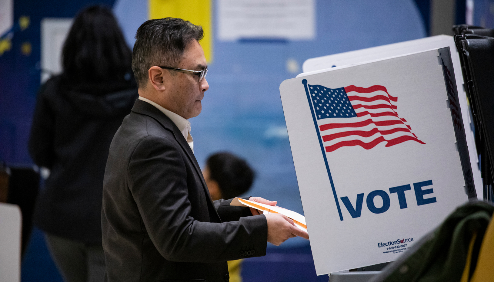 Person casting a ballot