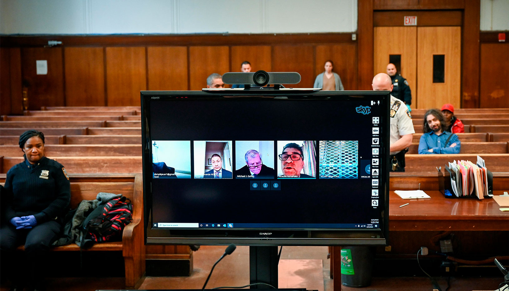 People using Skype to attend a remote court proceeding