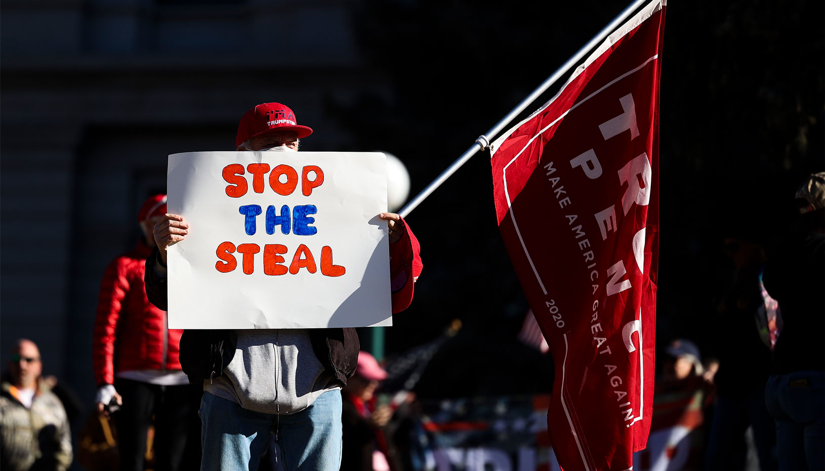 Trump supporter holding a "Stop the Steal" sign