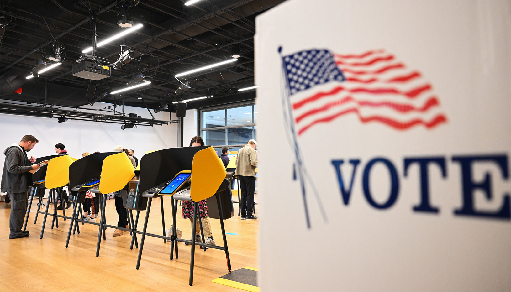 People casting ballots at polling place