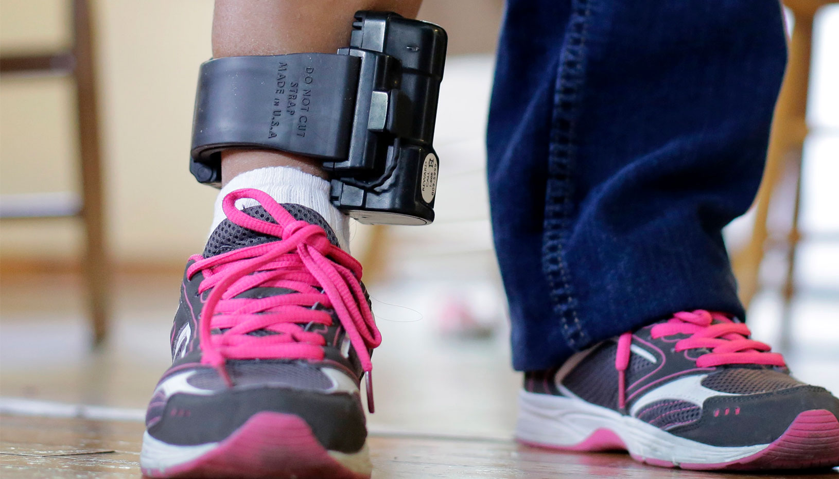Person wearing ankle monitor