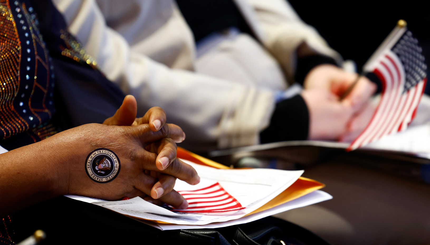 Woman's hands with hand painted with U.S. seal