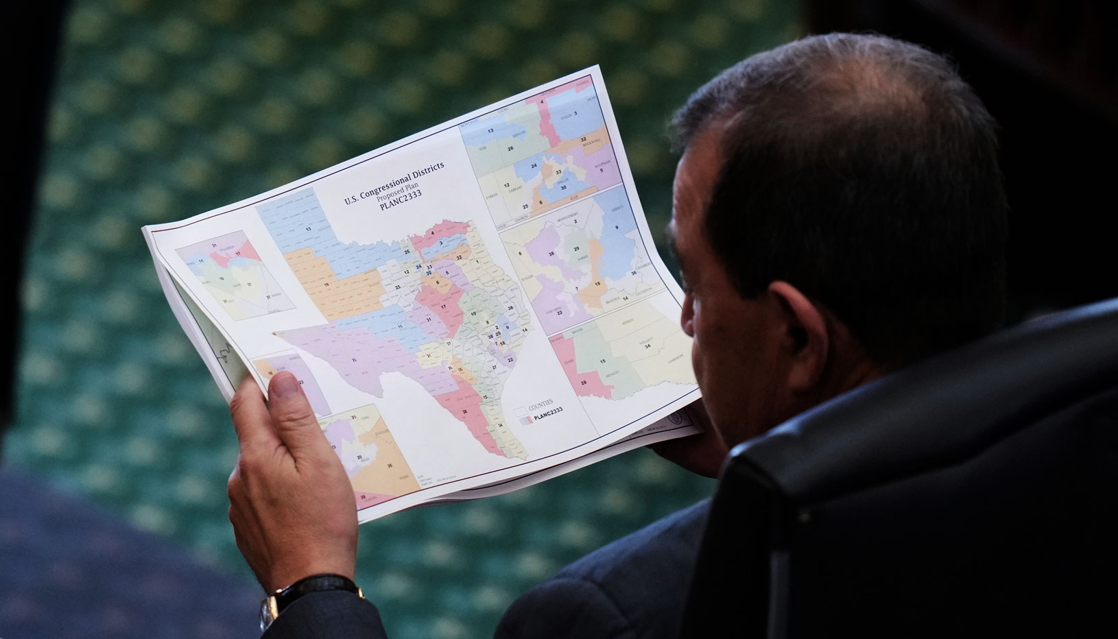 Texas district map in lawmker's hands