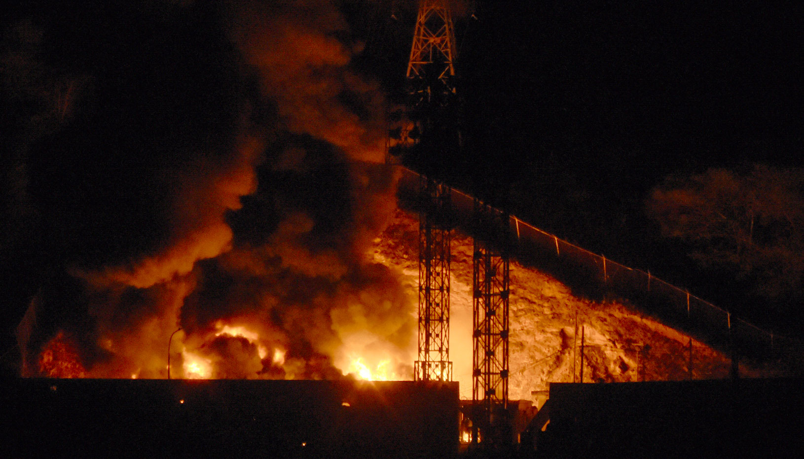 Rig on fire at night