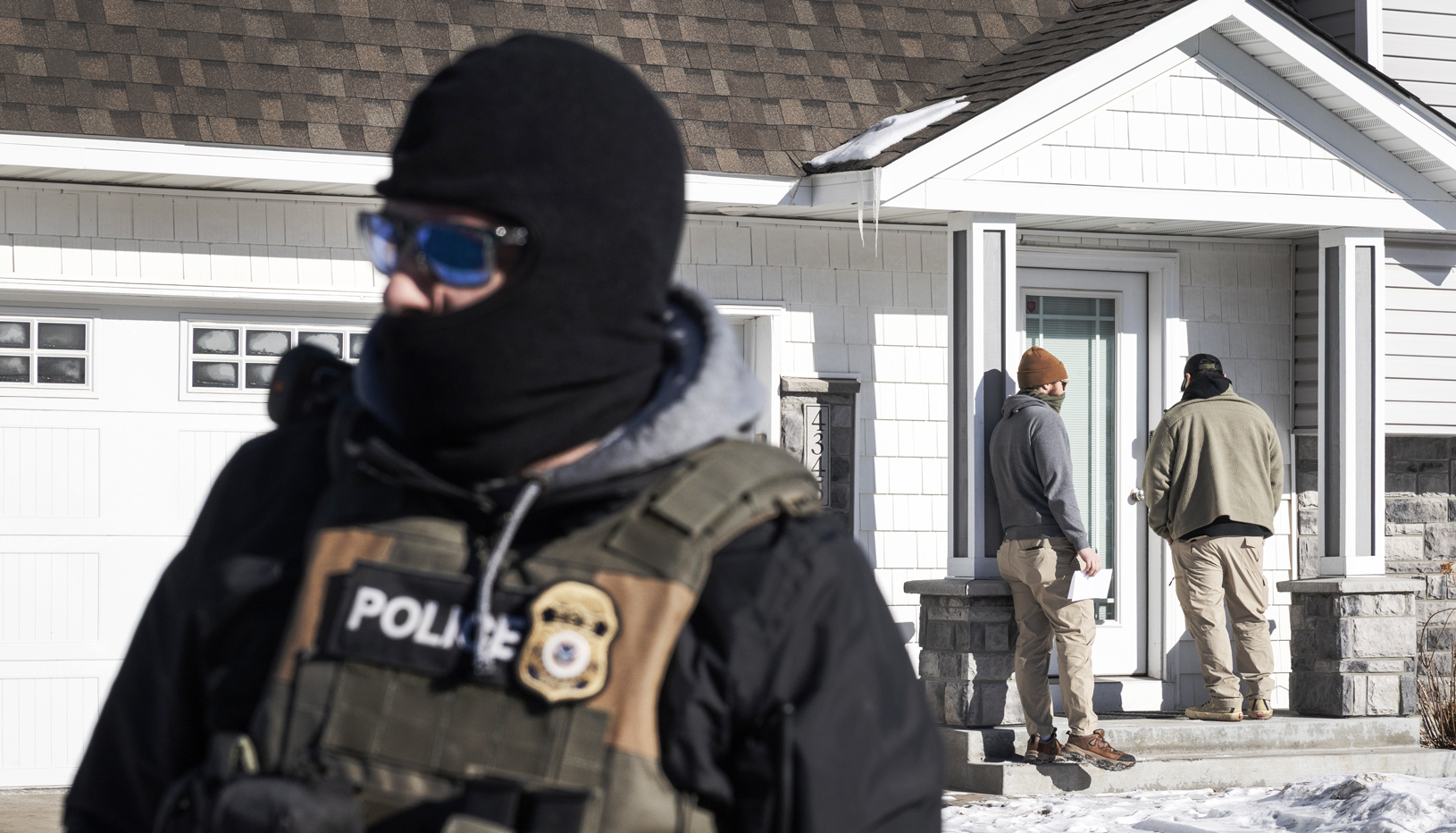ICE agents outside a private home in Minneapolis
