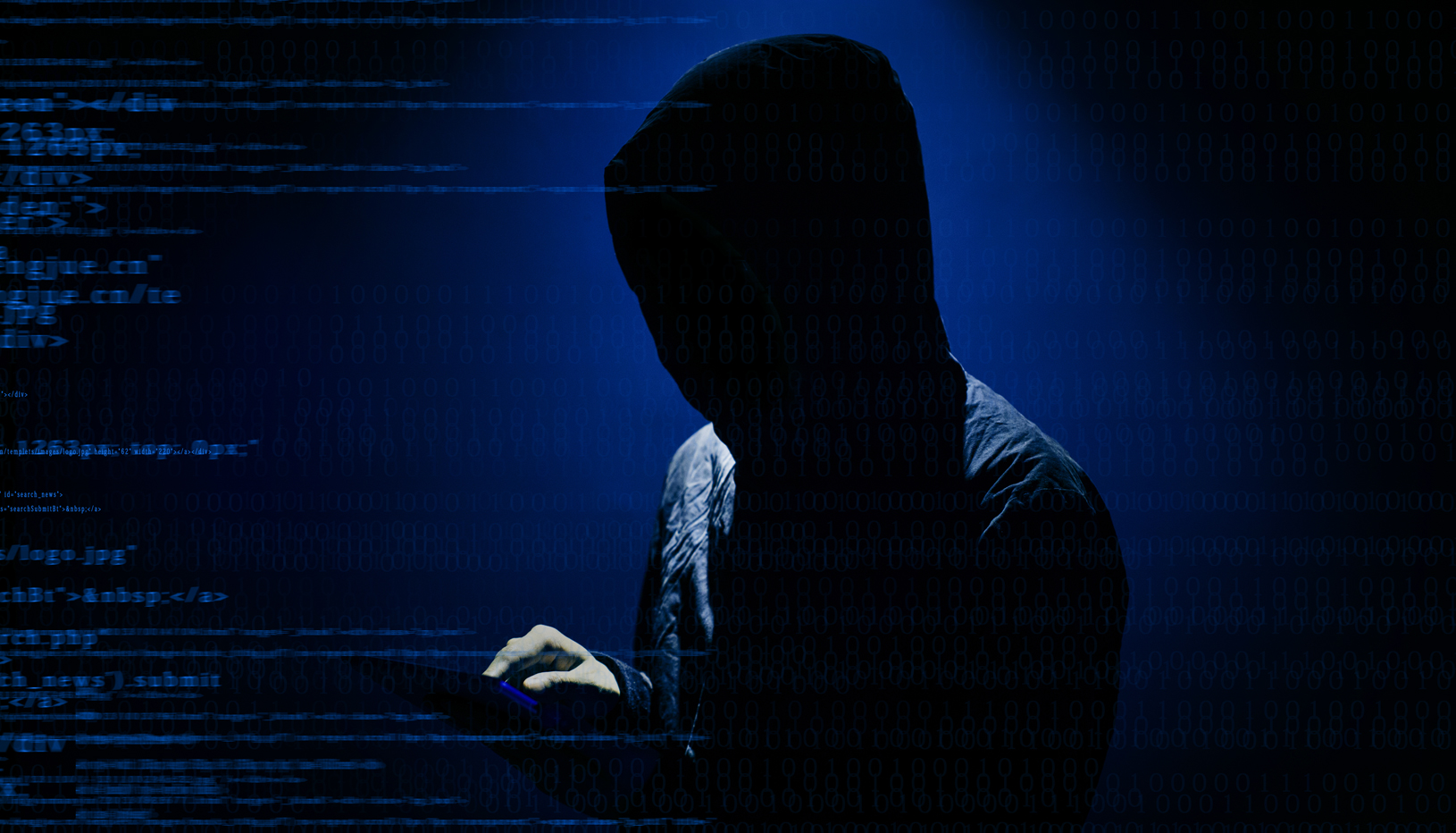 Hooded figure surrounded by lines of computer code