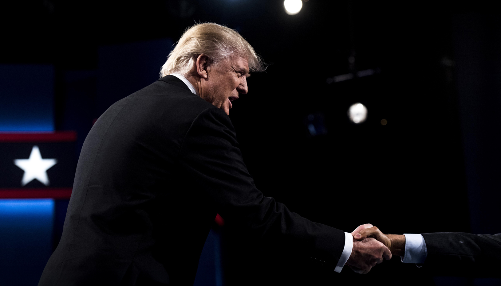 President Trump shaking hands with someone off-camera