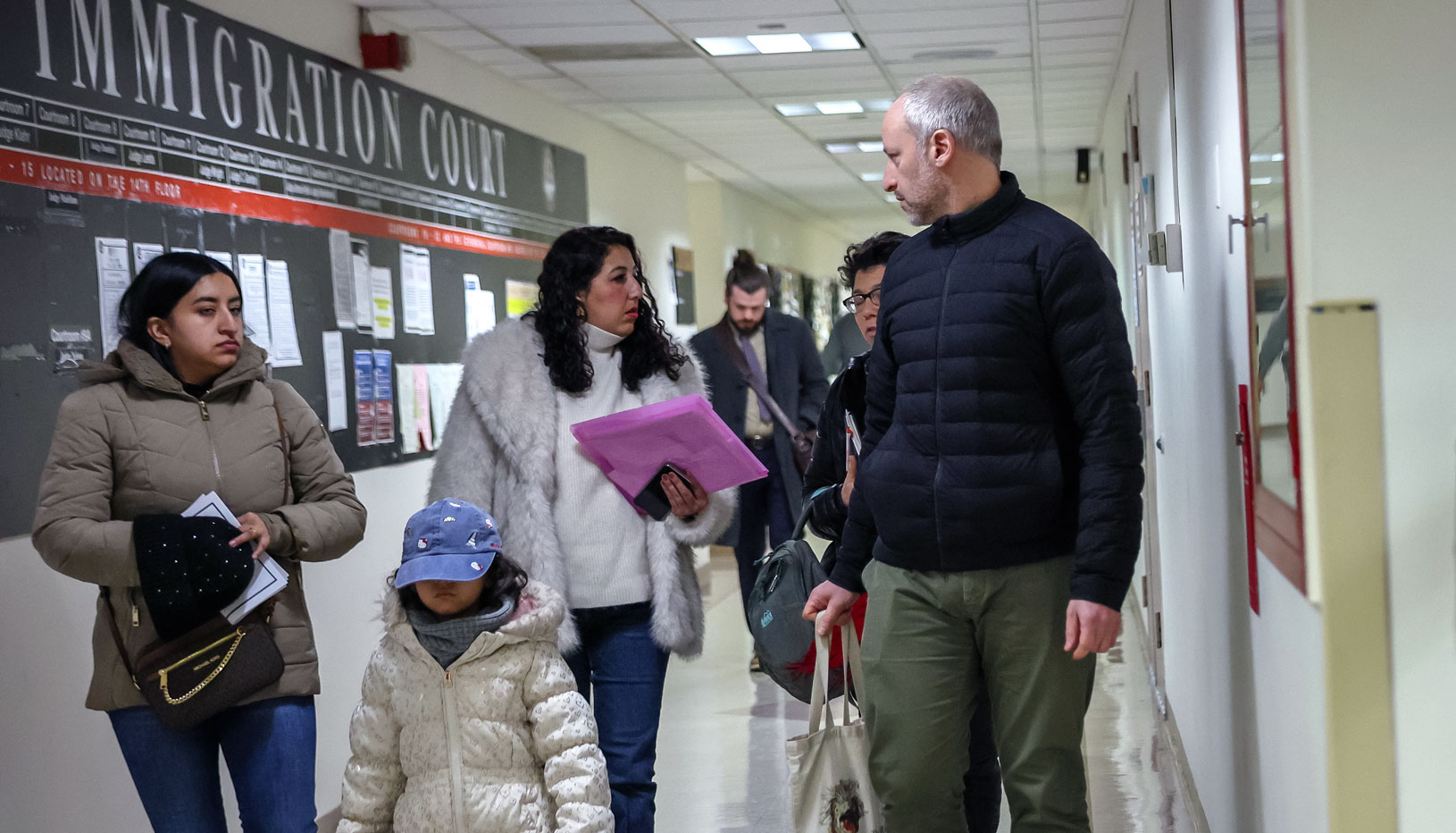 A family attends immigration court. 