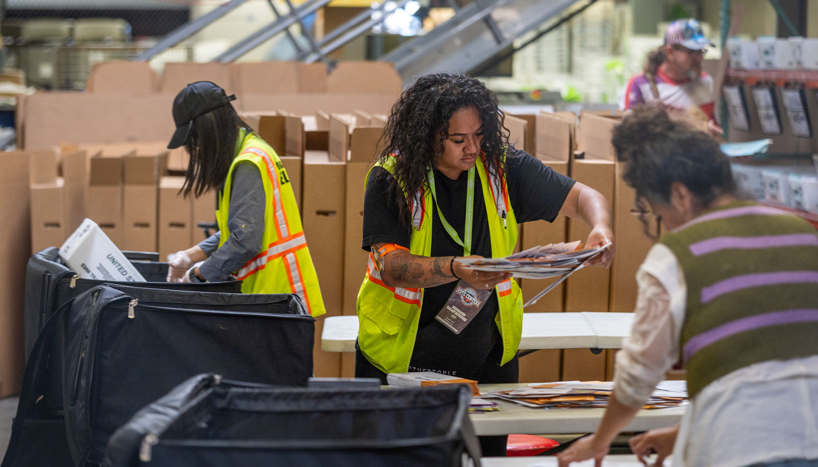 Election workers handling ballots
