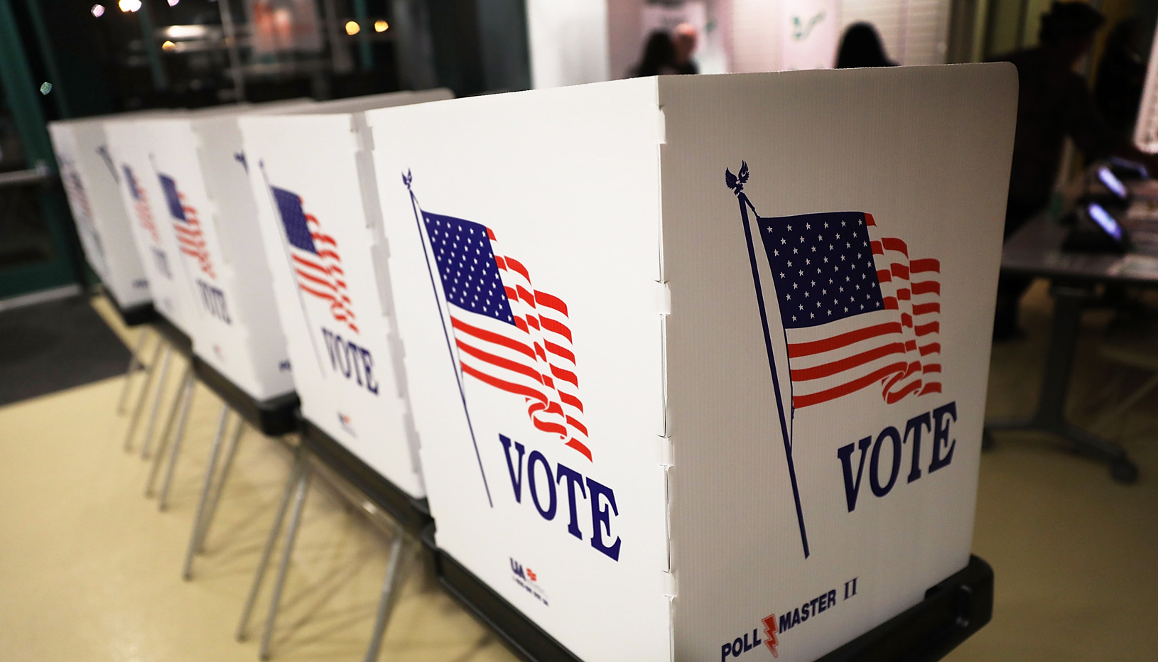 Voting booths with American flag