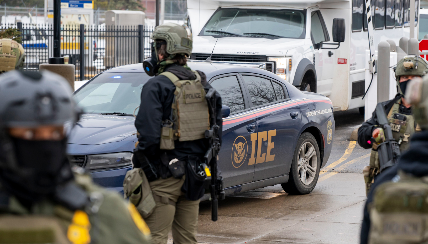 ICE officers and ICE police-style car
