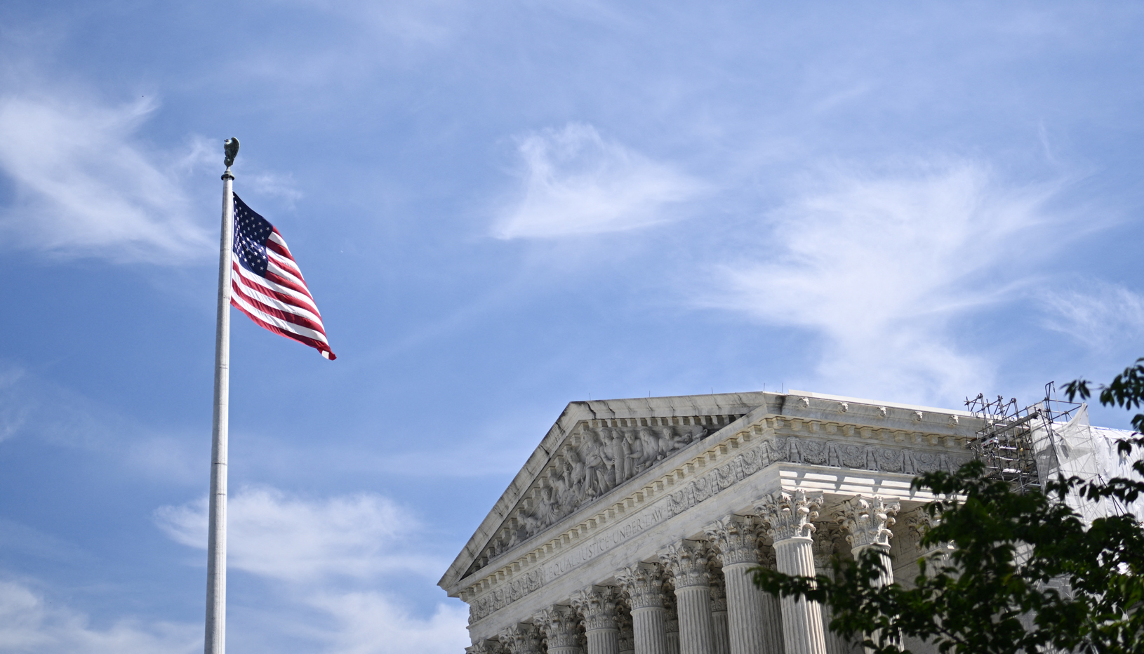 A flag flies in front of the U.S. Supreme Court