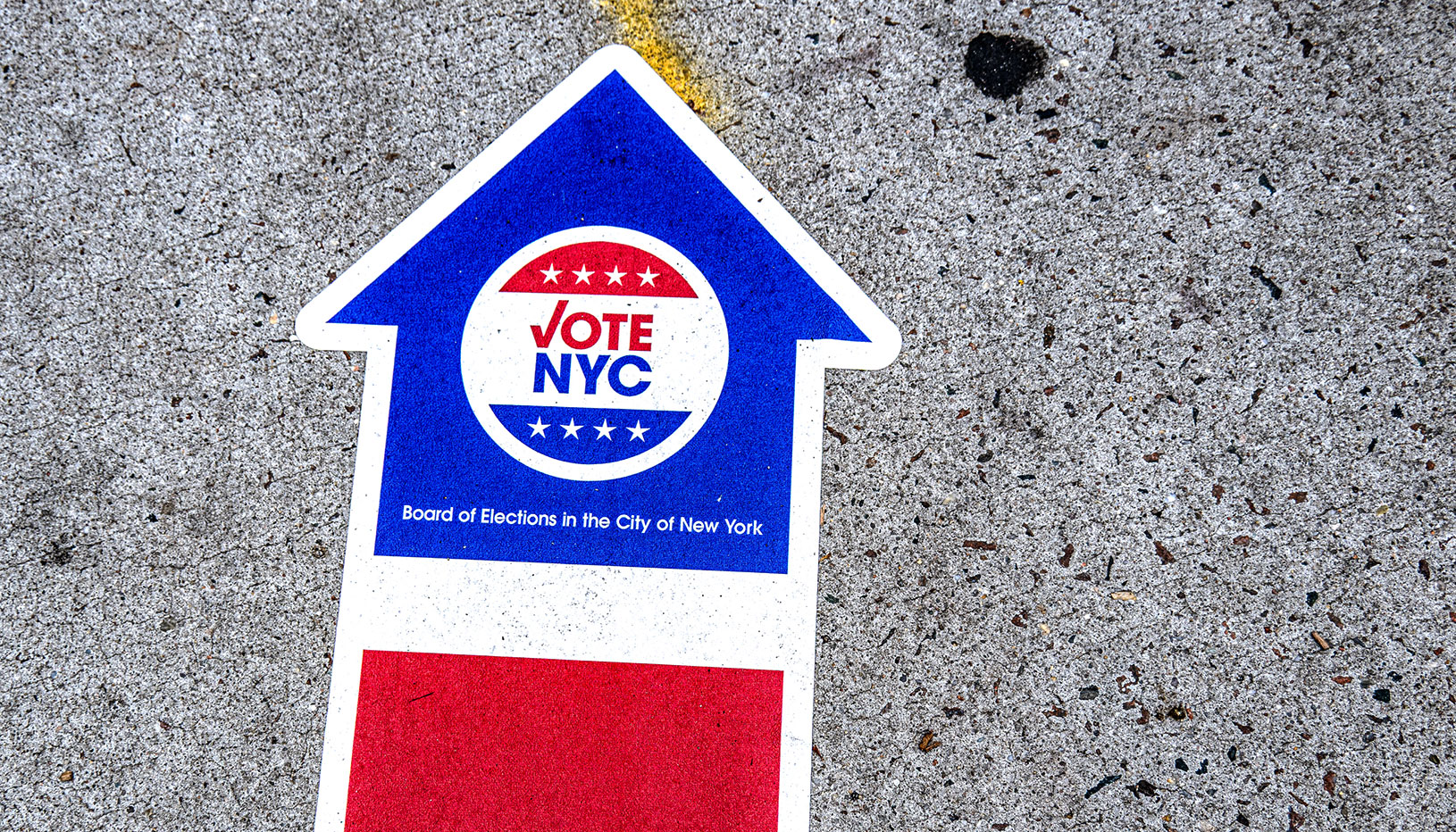 VoteNYC on arrow signage on ground