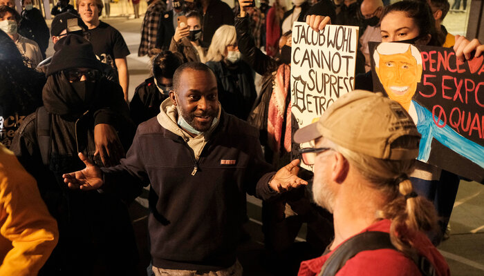 People speaking outside of ballot counting center