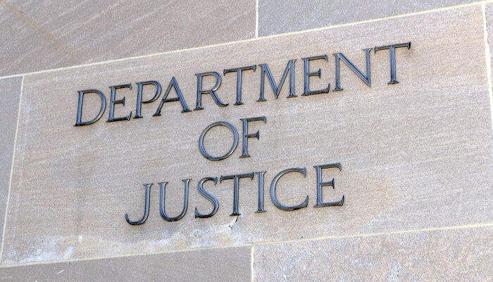 Department of Justice lettering on gray building