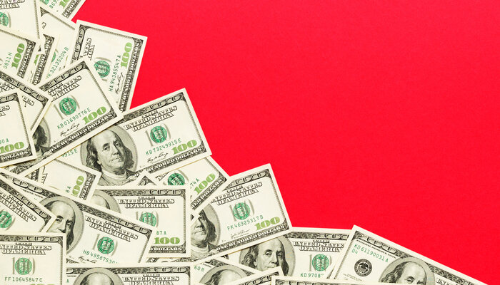 Illustration of spread of cash on red background
