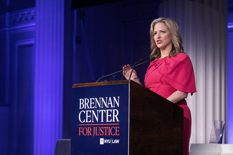 Jocelyn speaking at podium