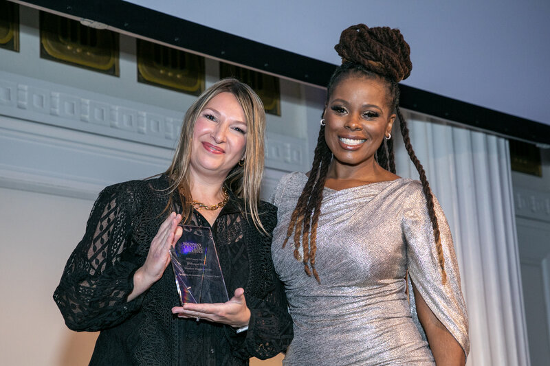 Heather and Sheena posing for the award