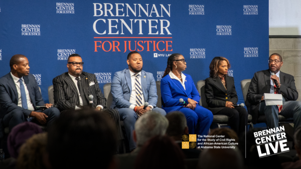 photo of panelists speaking at the live in-person event