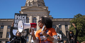 Voting rights activists protest Georgia voter suppression bills. 