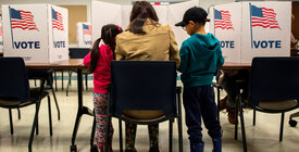 Children accompany voting woman