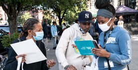 Census volunteers interview a person