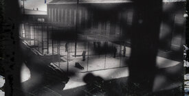View of a prison yard through a barred window