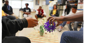 Teens sit in on a group counseling session.