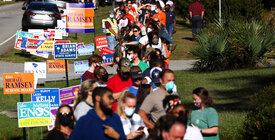 Voters wait in a very long line to vote. 