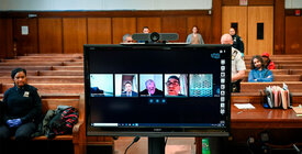 People using Skype to attend a remote court proceeding