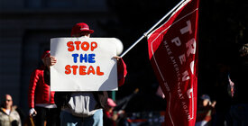 Trump supporter holding a "Stop the Steal" sign