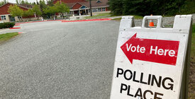 Sign pointing to a polling place
