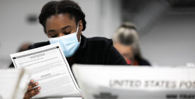 Woman Reviewing Ballot