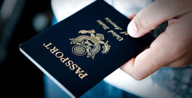 Hand holding U.S. passport