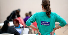 Poll watcher at a polling place