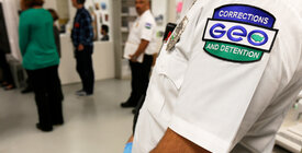 GEO Group logo on sleeve in foreground