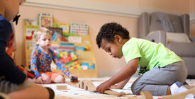 Children playing inside a daycare.
