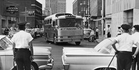 Police waiting for Freedom Riders on a bus.