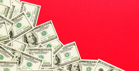 Illustration of spread of cash on red background