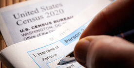 Person filling out census form