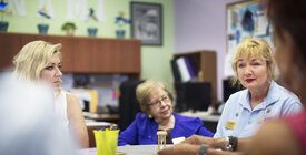 Three women sitting at a table