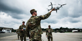 A U.S. soldier launching an armed drone