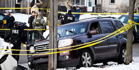 Car of R. Good surrounded by police tape