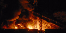 Rig on fire at night